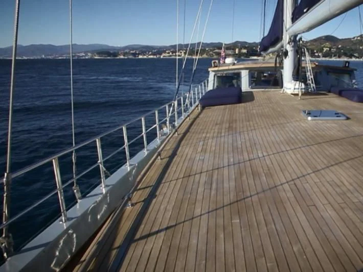a wooden dock with a boat on it aboard LA MER Yacht for Sale