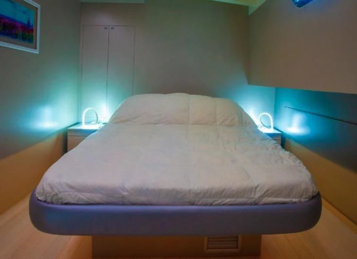 a bed in a room aboard LA MER Yacht for Sale