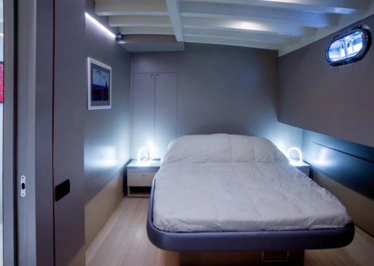 a bed in a room aboard LA MER Yacht for Sale