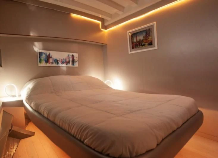 a bed in a room aboard LA MER Yacht for Sale