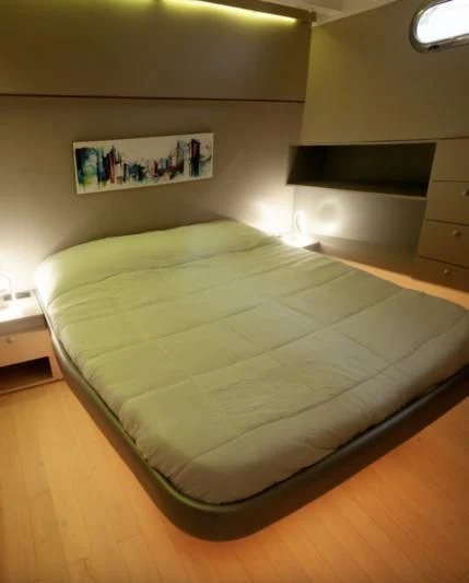 a bed in a room aboard LA MER Yacht for Sale
