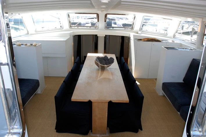 a table in a room aboard LA MER Yacht for Sale