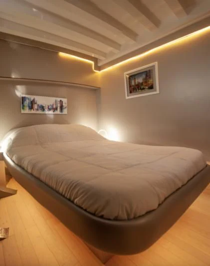 a bed in a room aboard LA MER Yacht for Sale