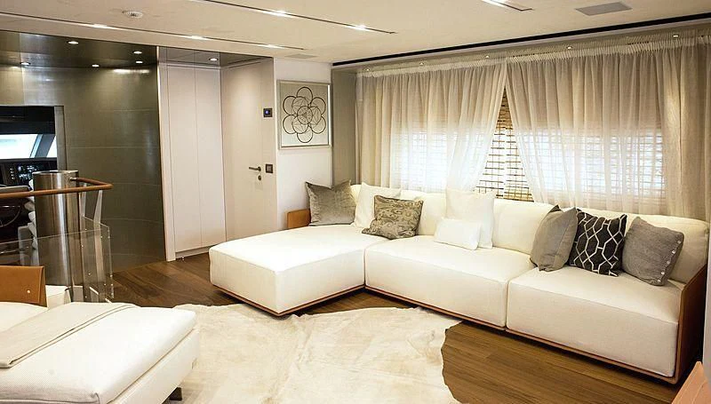 a living room with a white couch aboard R&R Yacht for Sale