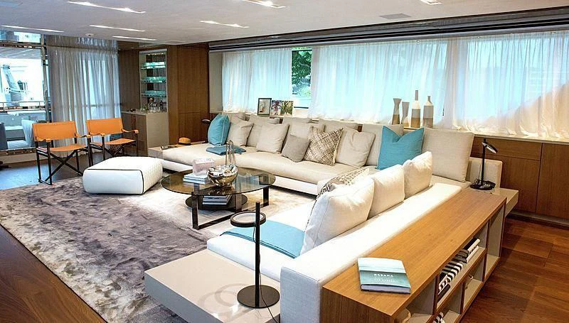 a living room with a couch and a coffee table aboard R&R Yacht for Sale