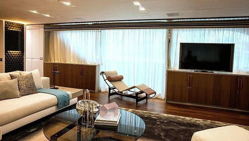 a living room with a large tv aboard R&R Yacht for Sale