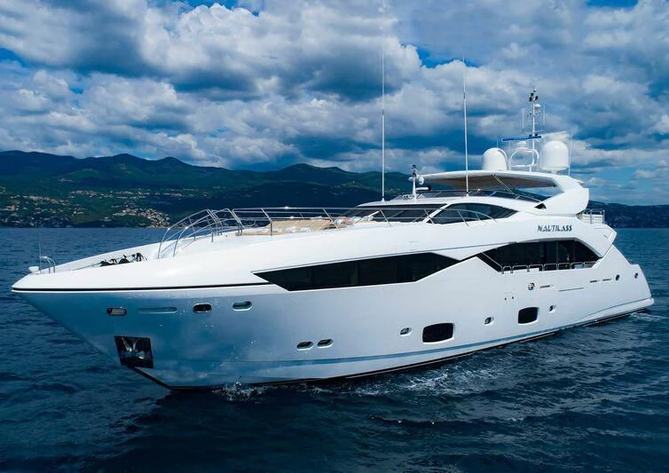 a white yacht in the water aboard WICKED PLAY Yacht for Sale