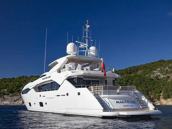 a large white boat on the water aboard WICKED PLAY Yacht for Sale