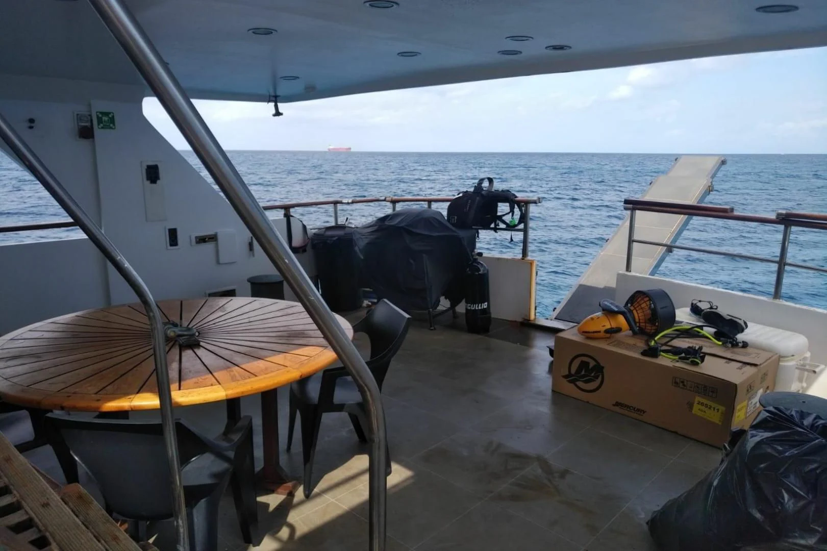 a boat with a table and chairs on the deck aboard STAR ALLIANCE Yacht for Sale