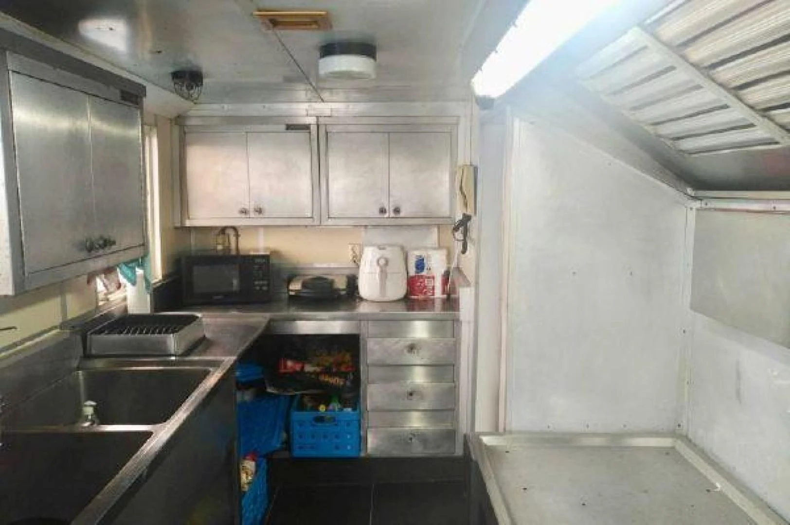 a kitchen with white cabinets aboard STAR ALLIANCE Yacht for Sale