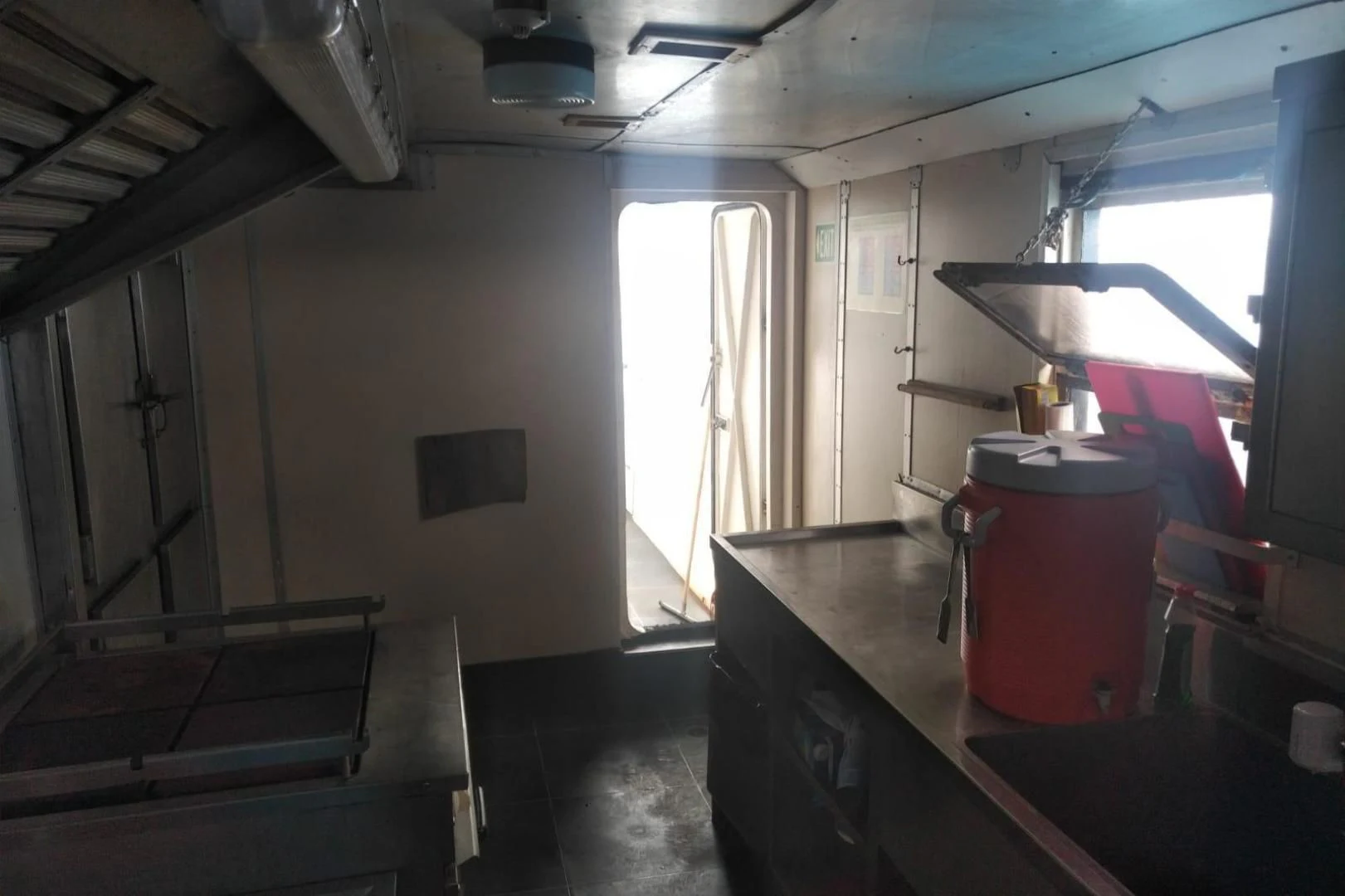 a room with a red bucket aboard STAR ALLIANCE Yacht for Sale