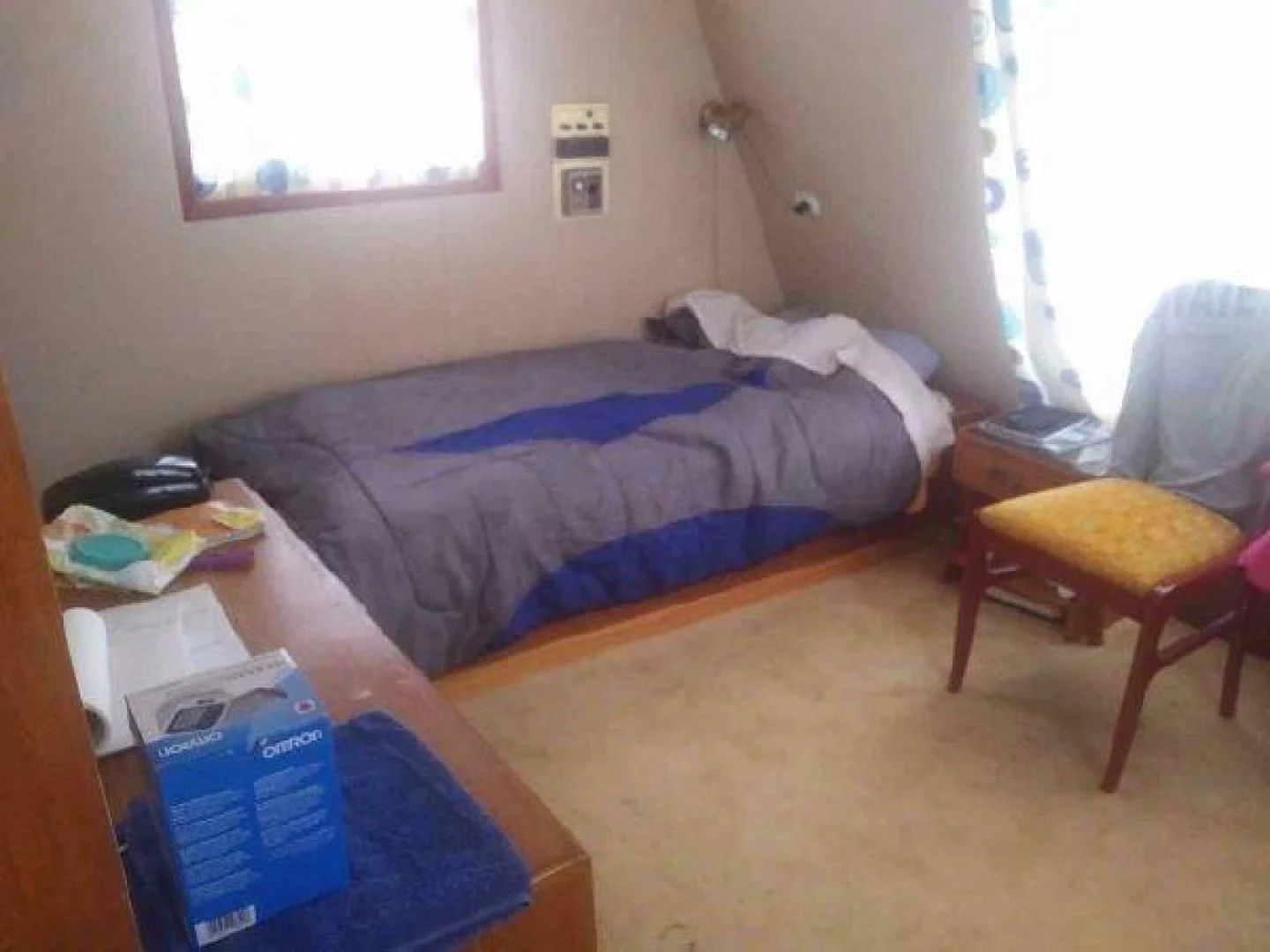 a room with a bed and a chair aboard STAR ALLIANCE Yacht for Sale