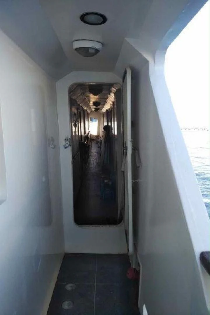 a person standing in a doorway aboard STAR ALLIANCE Yacht for Sale