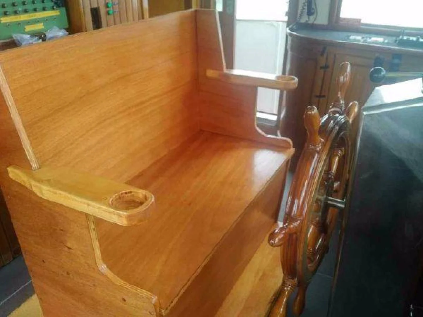 a wooden table with a chair aboard STAR ALLIANCE Yacht for Sale
