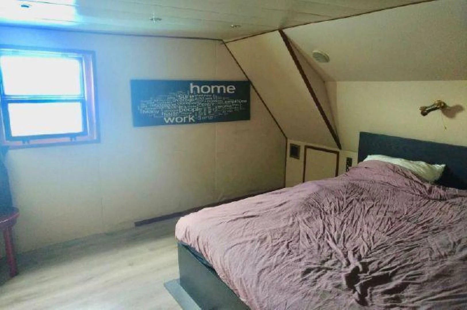 a bed with a sign on the wall aboard STAR ALLIANCE Yacht for Sale