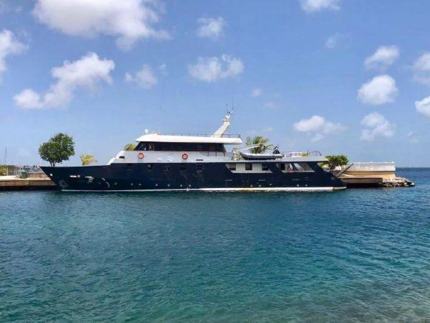 a large boat in the water aboard STAR ALLIANCE Yacht for Sale