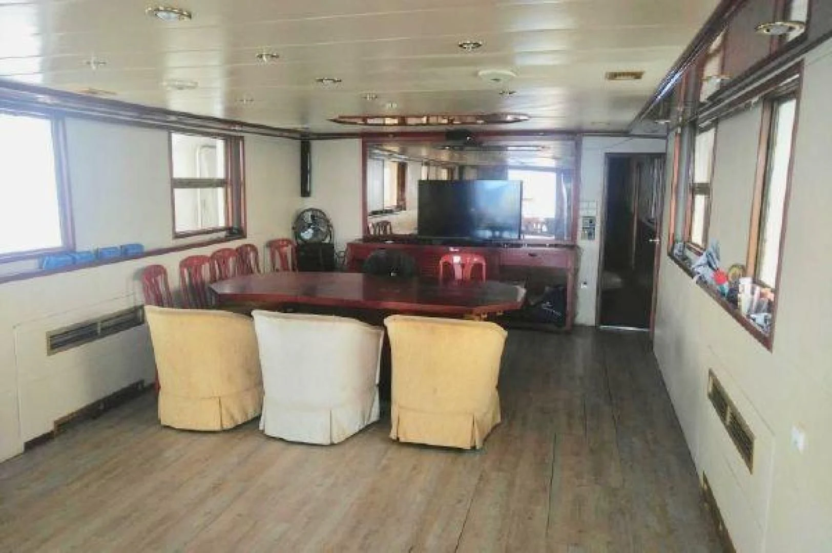 a kitchen with a table and chairs aboard STAR ALLIANCE Yacht for Sale