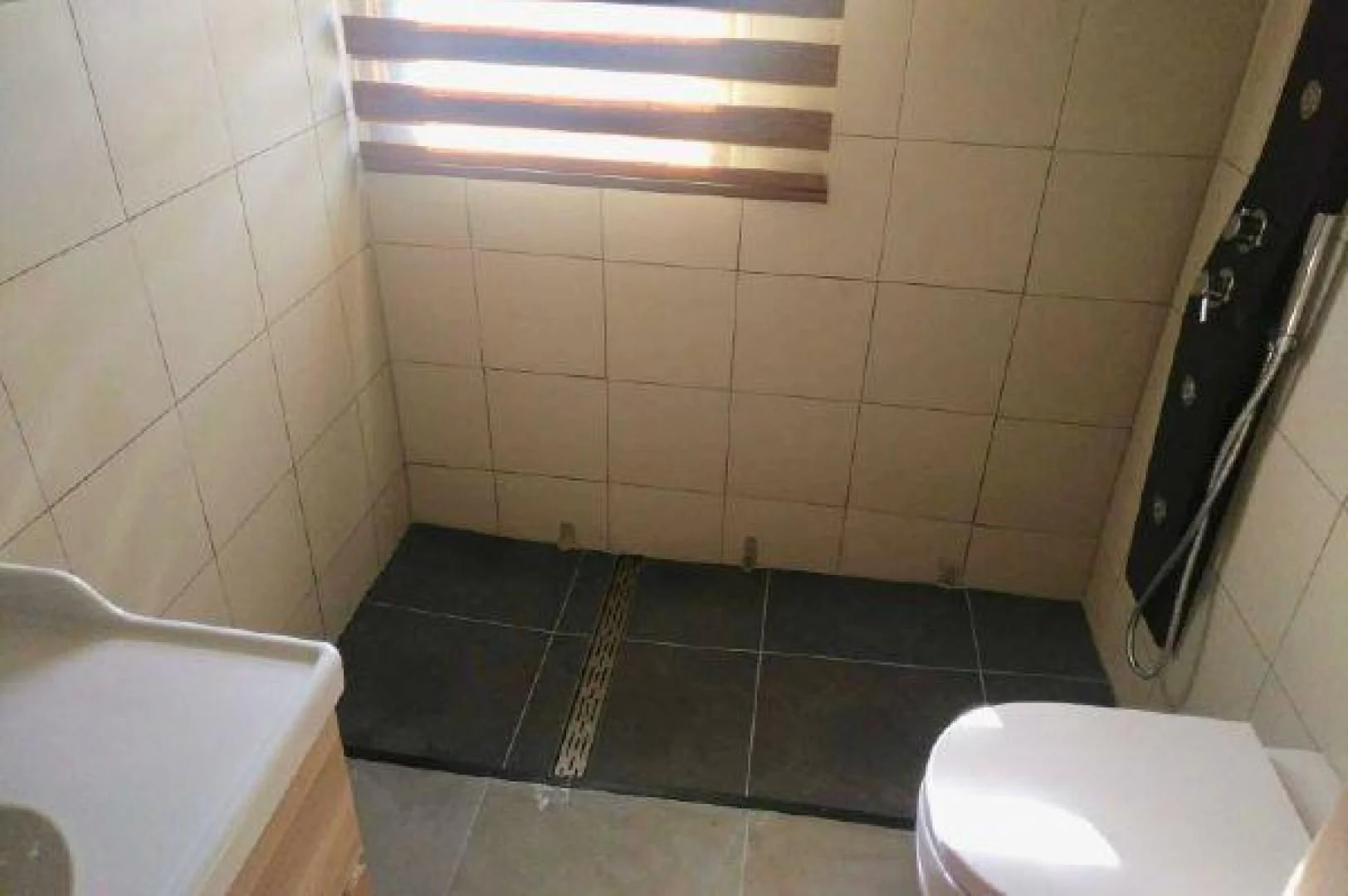 a bathroom with a tile floor aboard STAR ALLIANCE Yacht for Sale