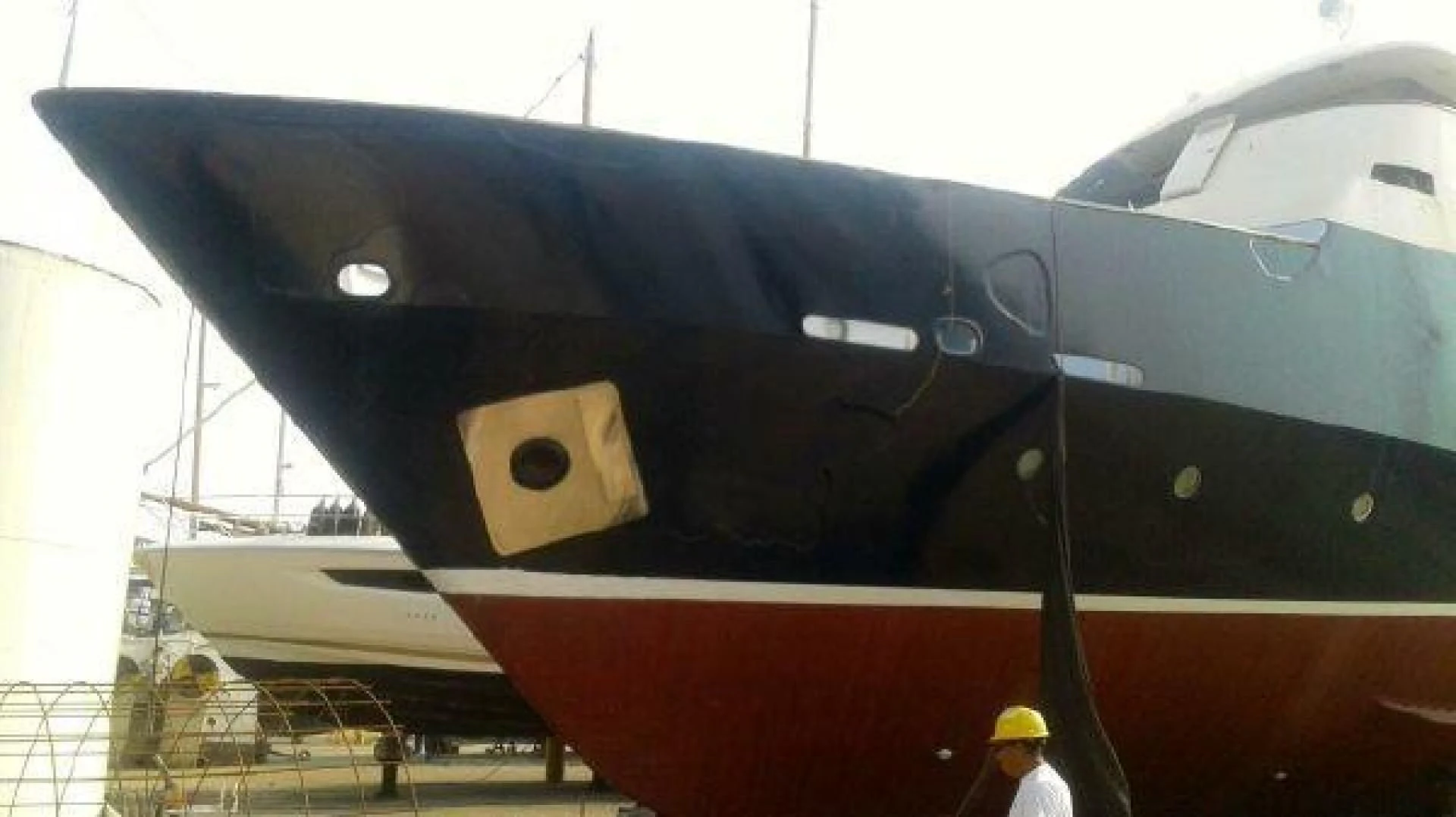 a person standing next to a plane aboard STAR ALLIANCE Yacht for Sale