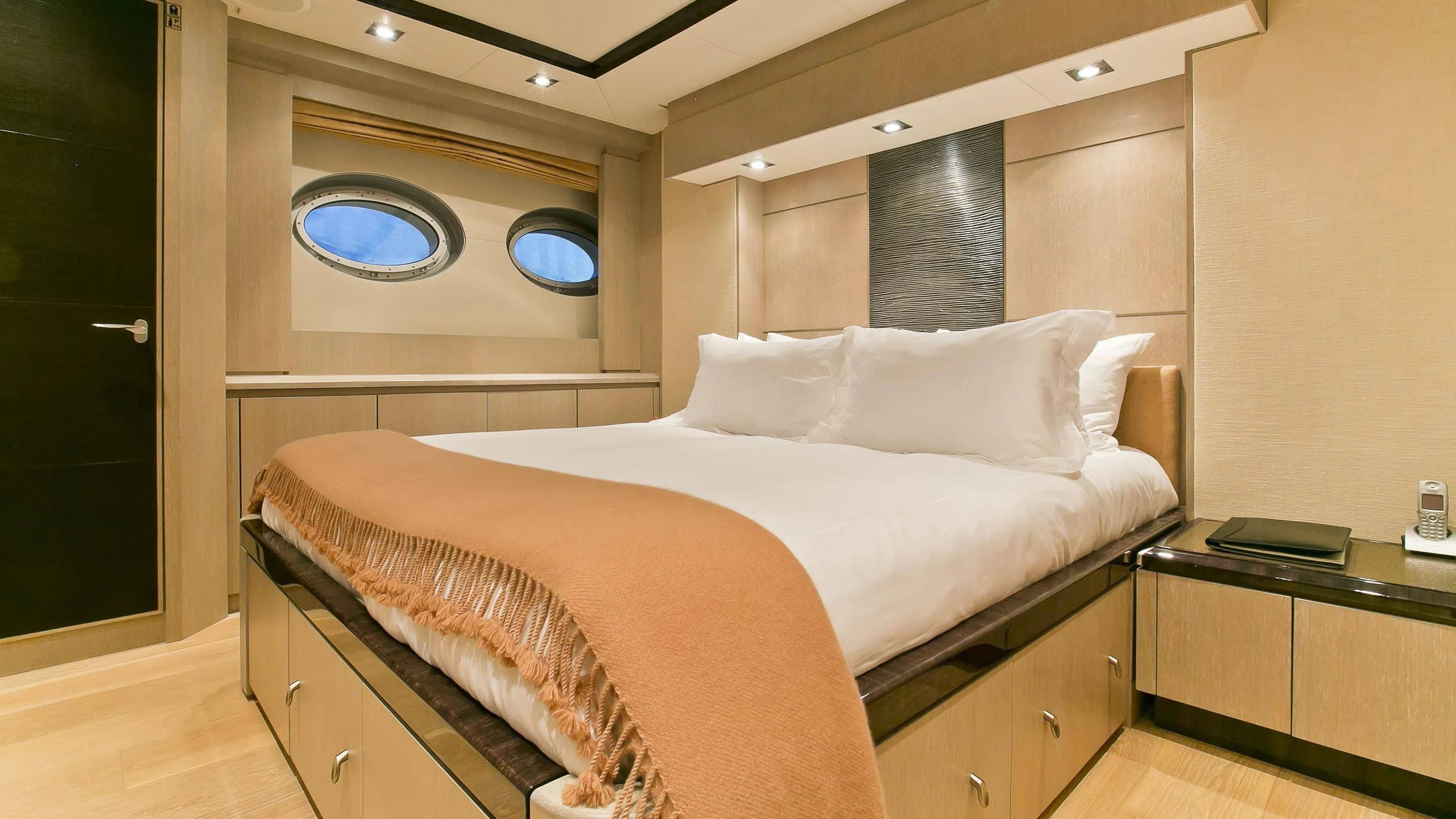 a bed with white sheets aboard AK ROYALTY Yacht for Sale