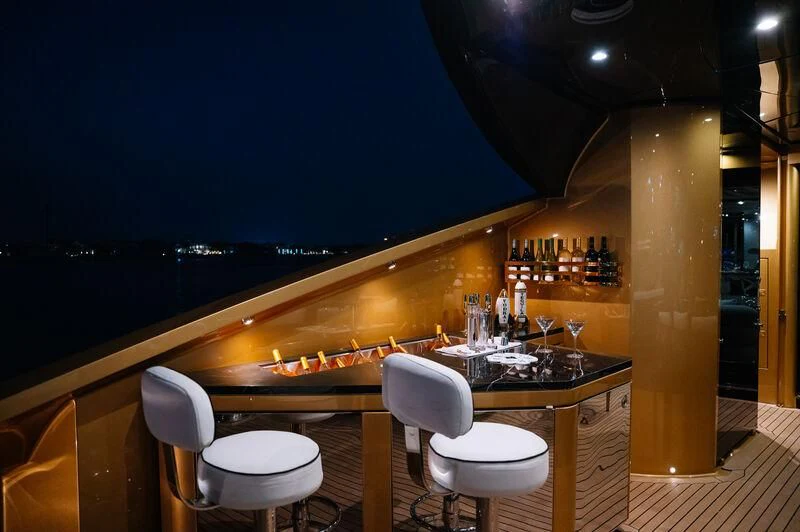 a piano in a room aboard AK ROYALTY Yacht for Sale