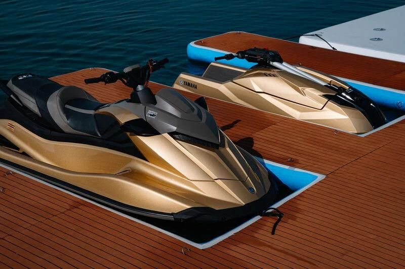 a violin on a wooden surface aboard AK ROYALTY Yacht for Sale