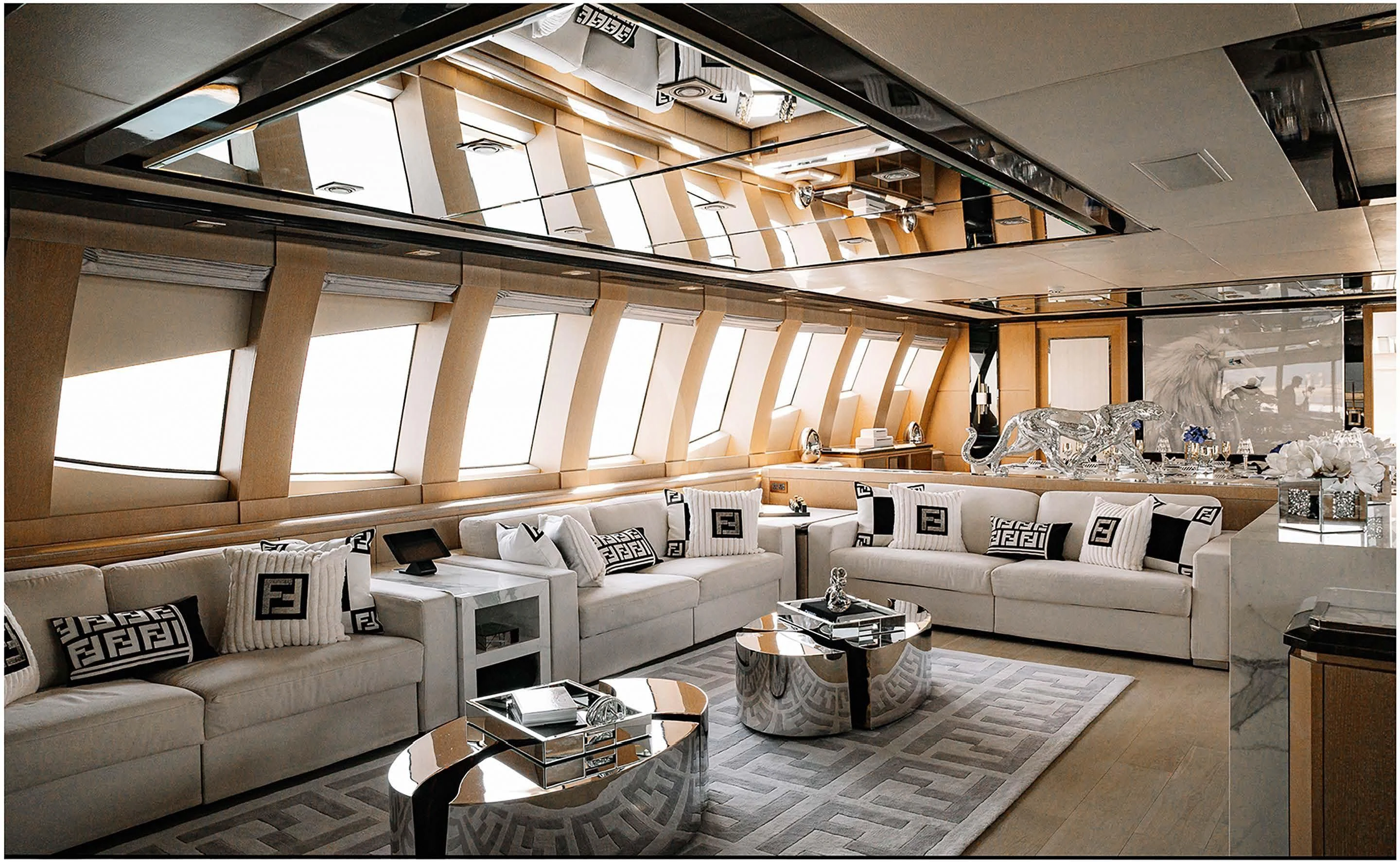 a room with couches and a table aboard AK ROYALTY Yacht for Sale