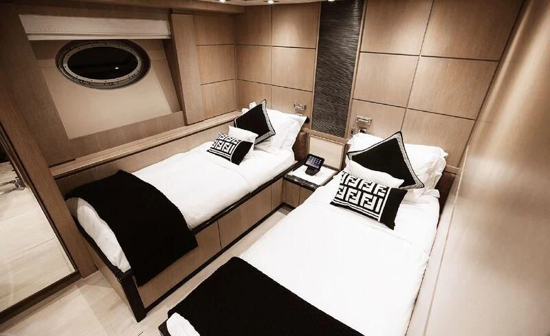 a room with a bed and a desk aboard AK ROYALTY Yacht for Sale
