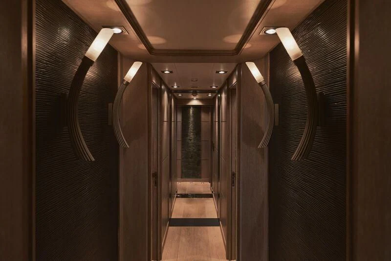 a hallway with many doors aboard AK ROYALTY Yacht for Sale