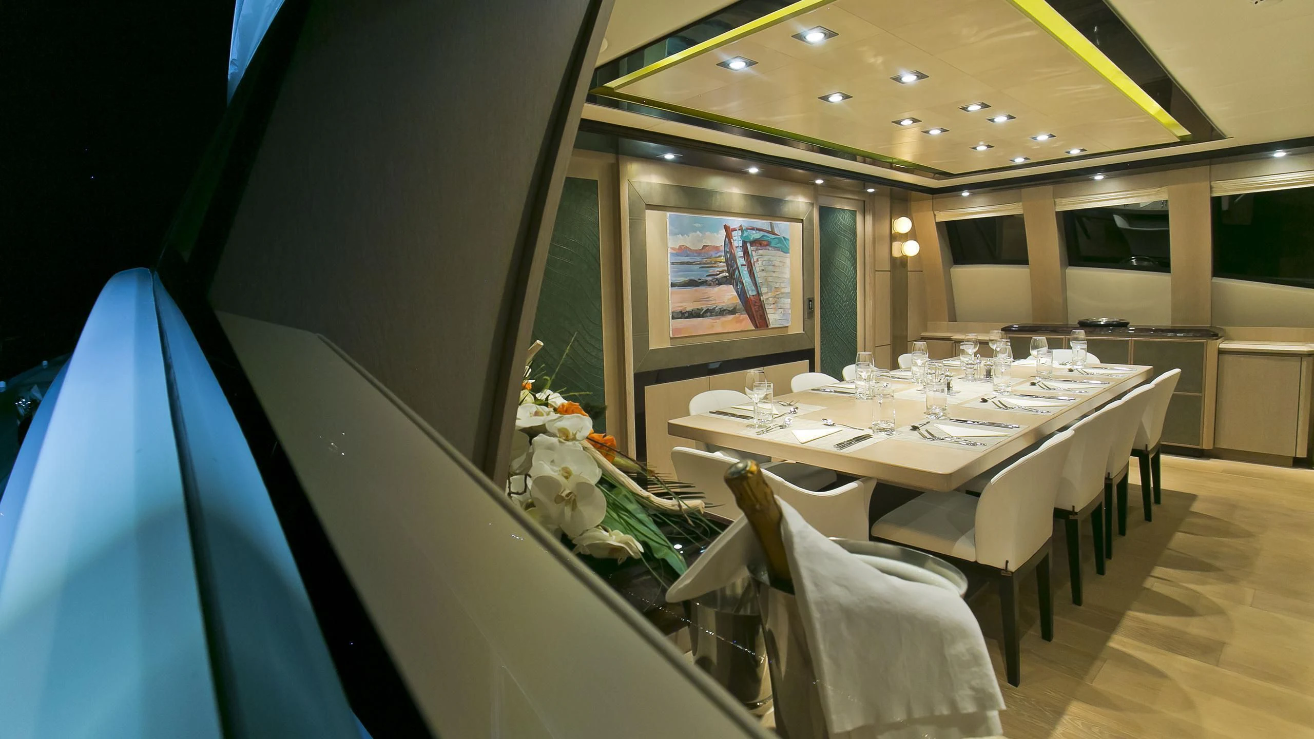 a dining room with a table and chairs aboard AK ROYALTY Yacht for Sale