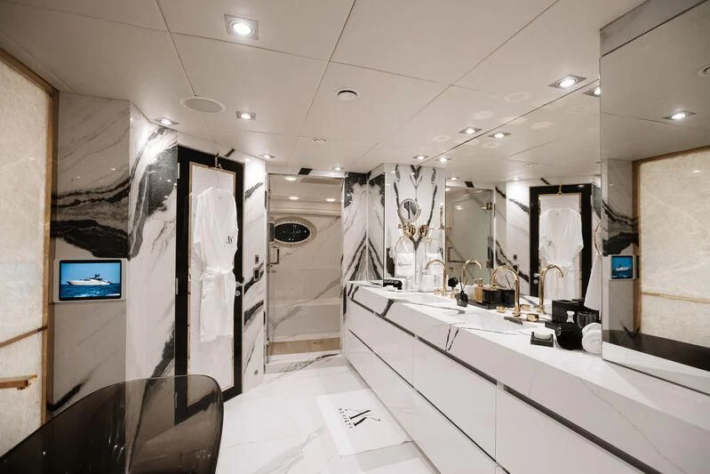 a bathroom with a large mirror aboard AK ROYALTY Yacht for Sale