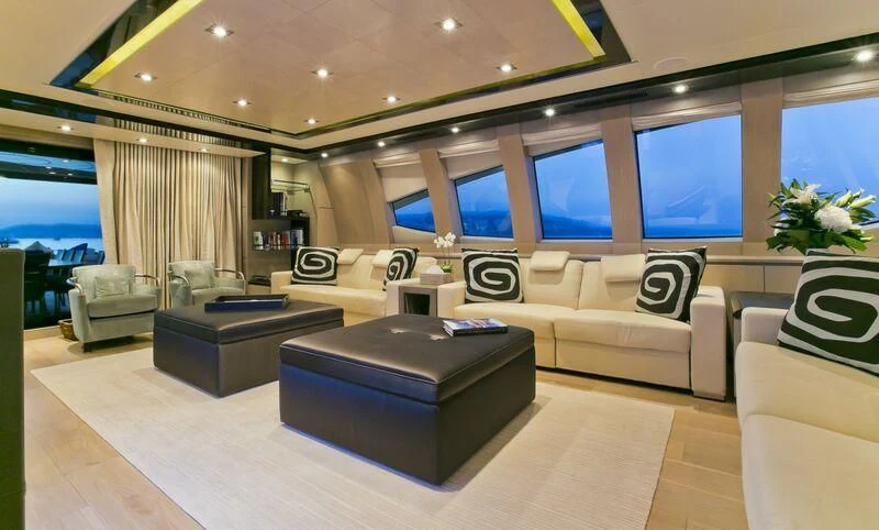 a large living room with a large window aboard AK ROYALTY Yacht for Sale