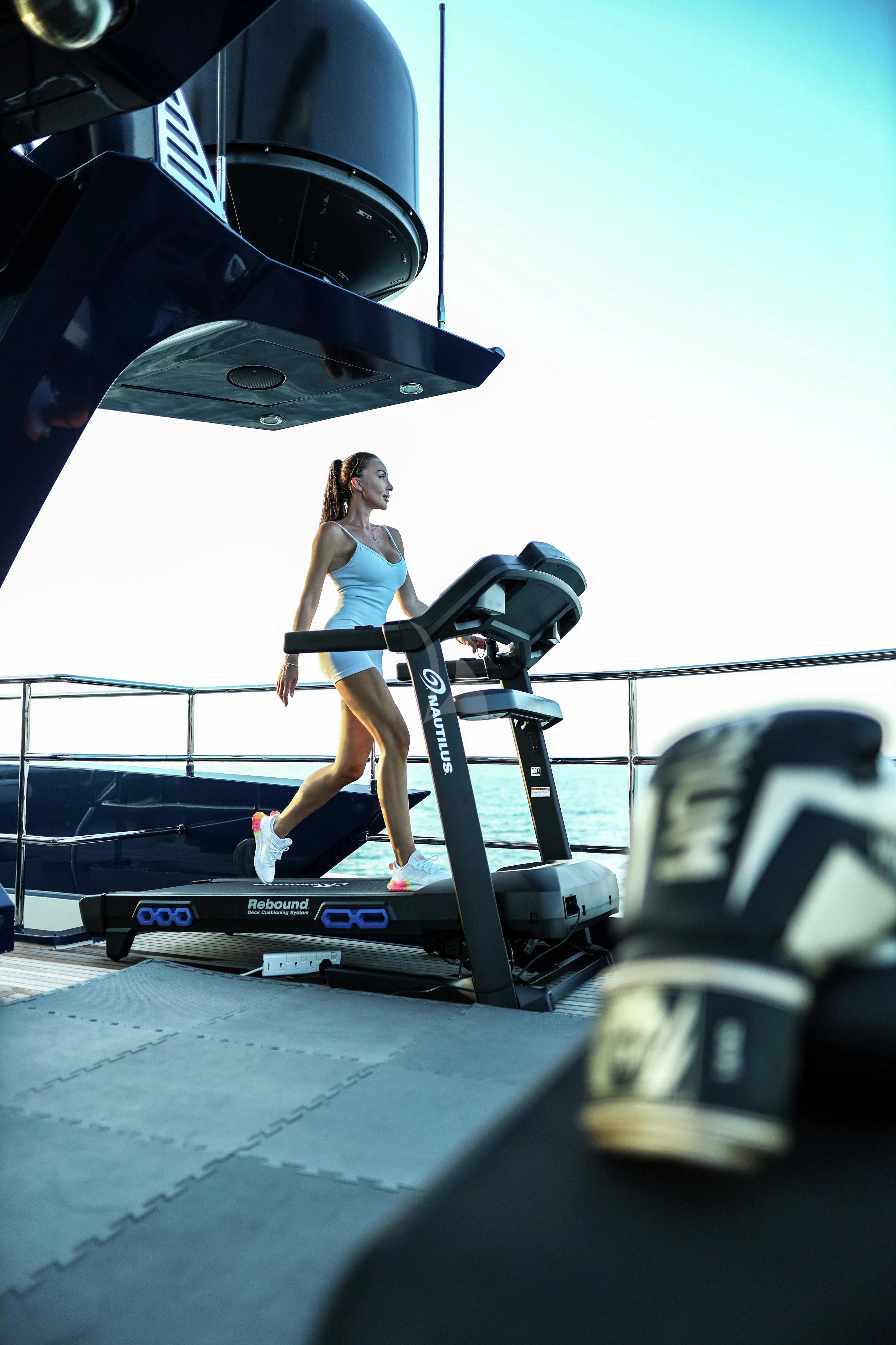 a person sitting on a treadmill aboard AK ROYALTY Yacht for Sale