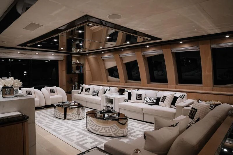 a living room with a large window aboard AK ROYALTY Yacht for Sale