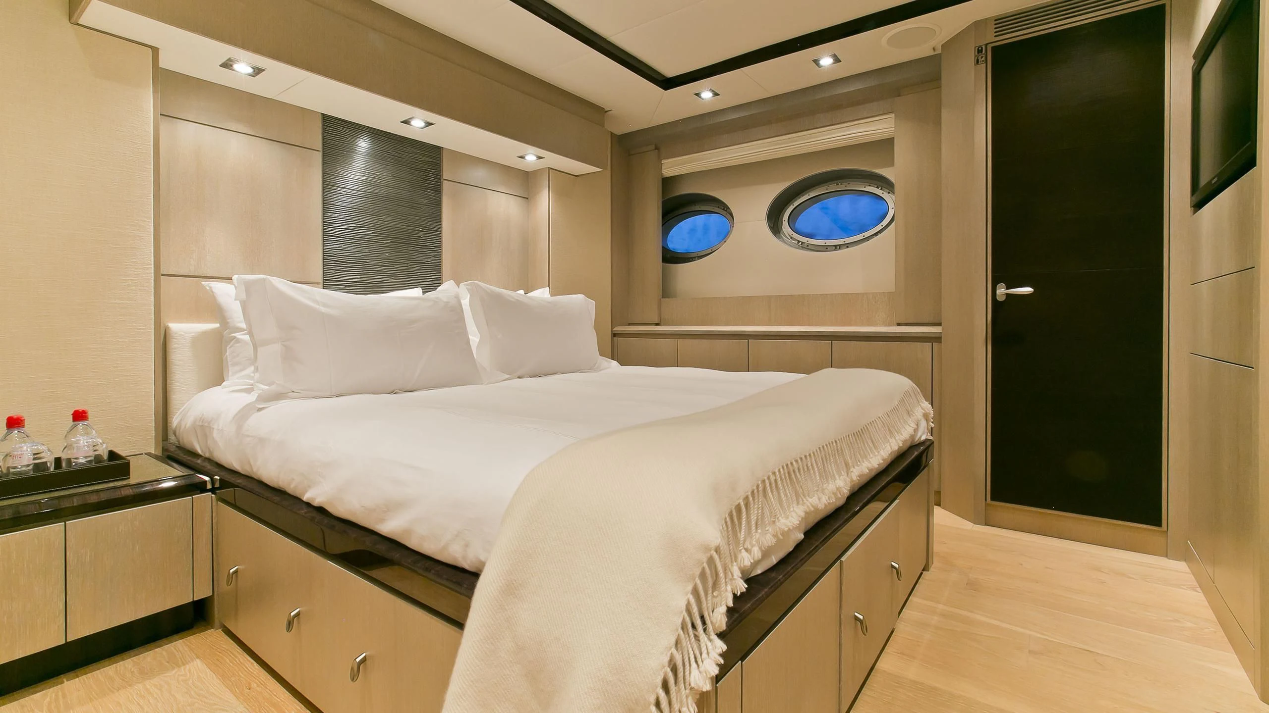 a bed with white sheets aboard AK ROYALTY Yacht for Sale