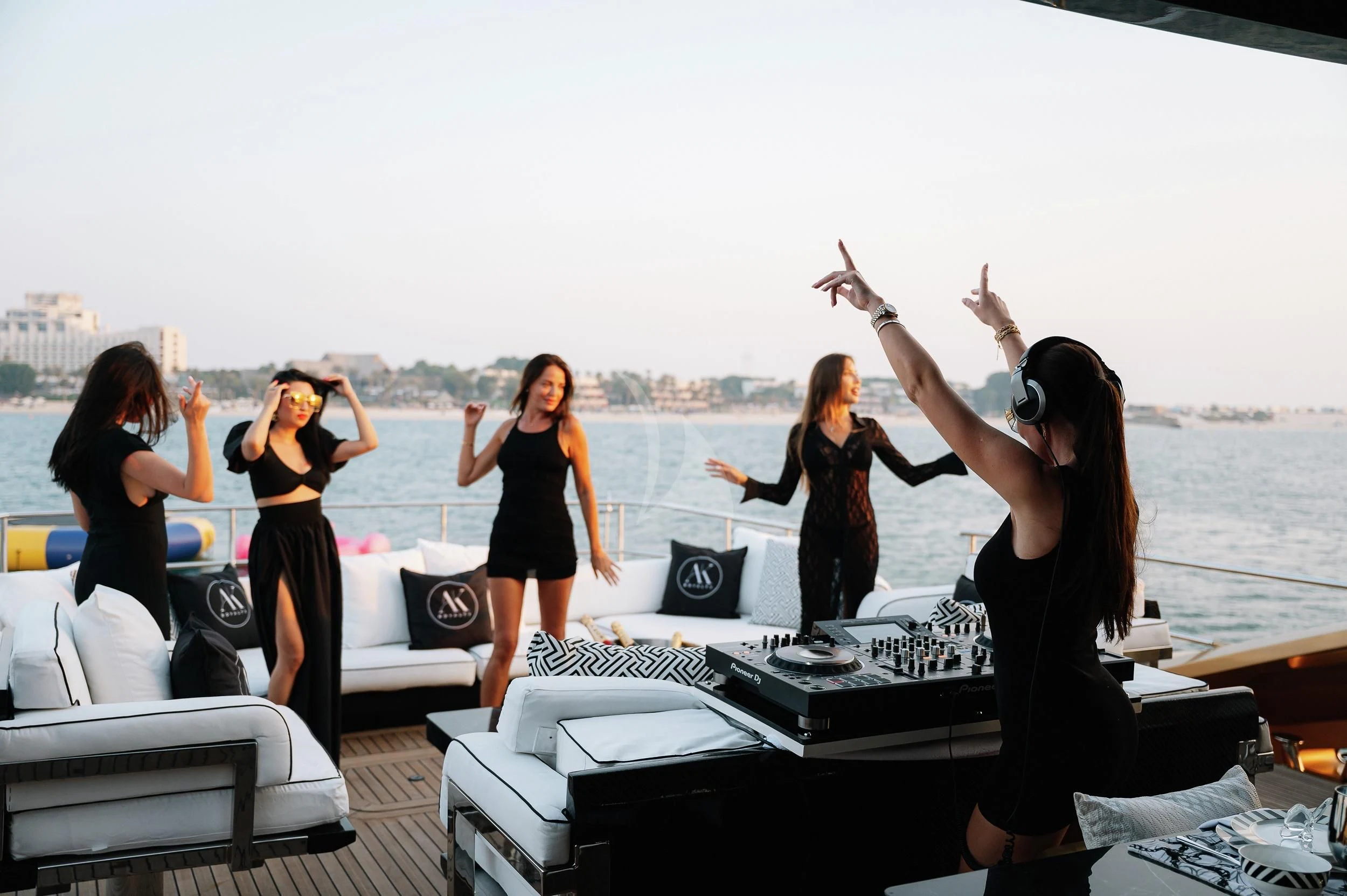 a group of women on a rooftop aboard AK ROYALTY Yacht for Sale