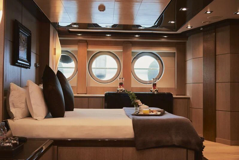 a room with a couch and a window aboard AK ROYALTY Yacht for Sale