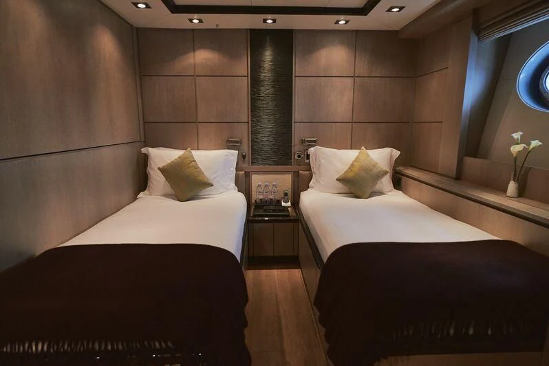 a room with two beds aboard AK ROYALTY Yacht for Sale