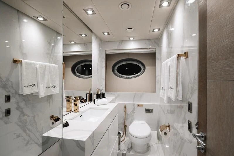 a bathroom with a large mirror aboard AK ROYALTY Yacht for Sale