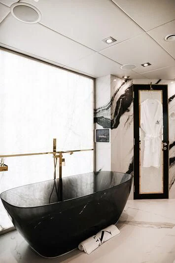 a bathtub in a bathroom aboard AK ROYALTY Yacht for Sale
