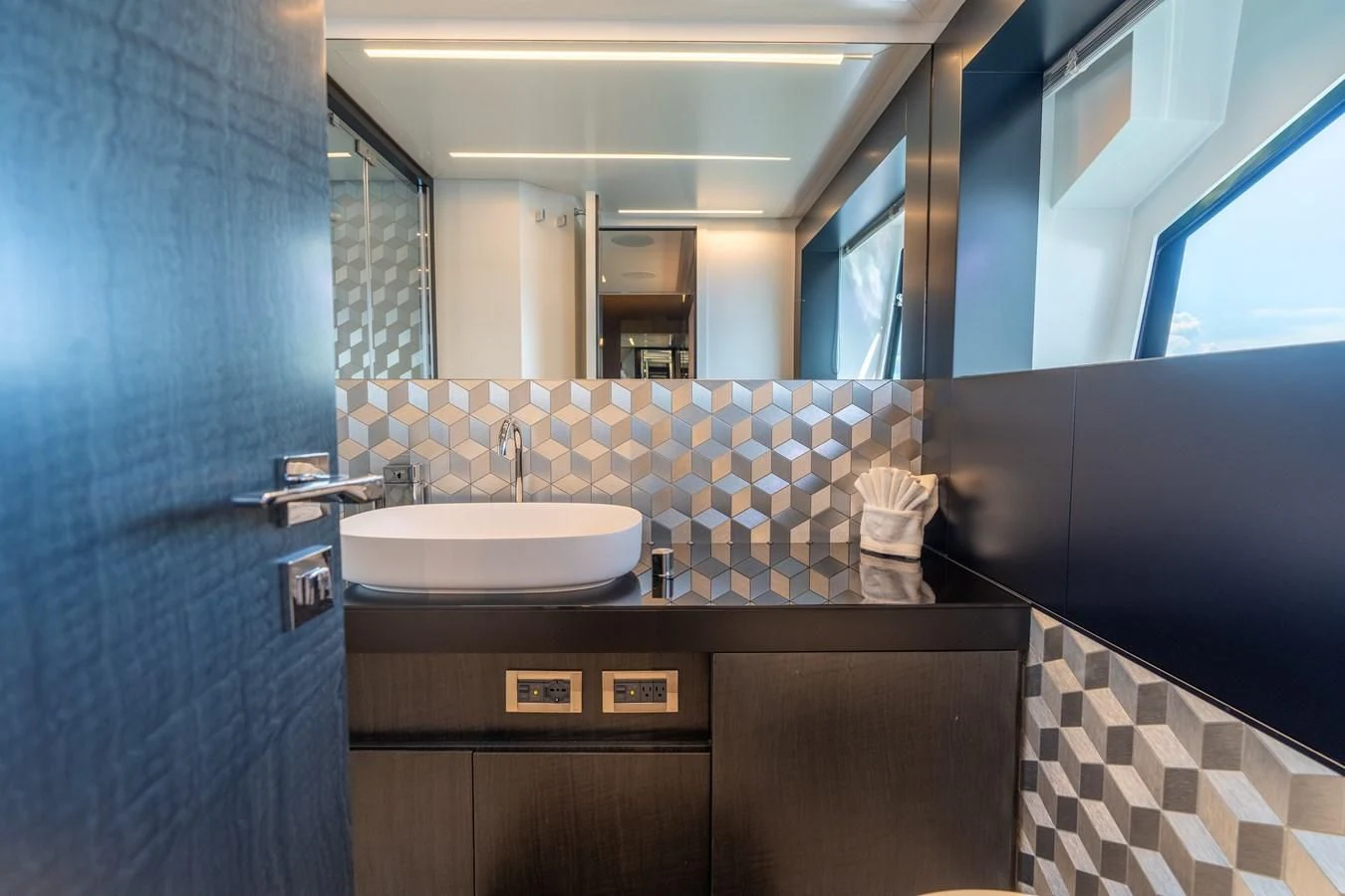 a bathroom with a sink and a mirror aboard VINTAGE Yacht for Sale