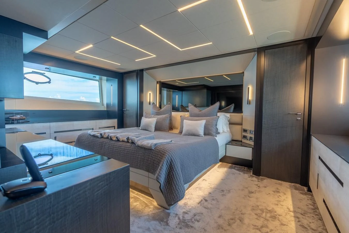 a room with a bed and a desk aboard VINTAGE Yacht for Sale