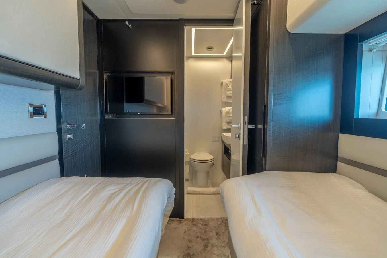 a room with a bed and a closet aboard VINTAGE Yacht for Sale