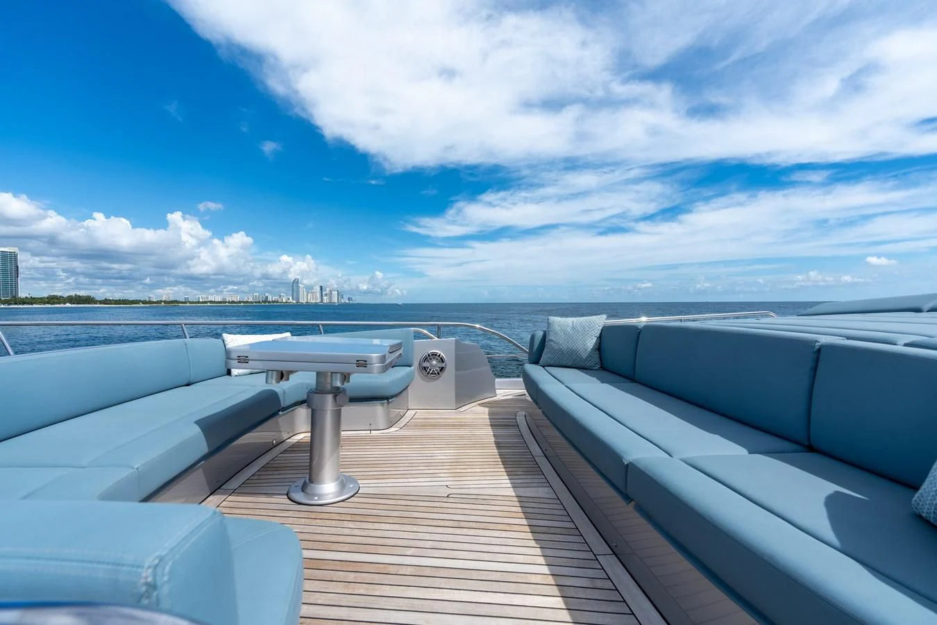 a deck with a view of the water and a city aboard VINTAGE Yacht for Sale