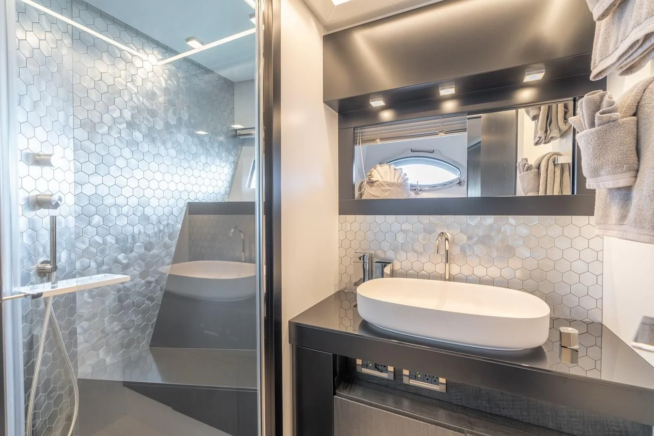 a bathroom with a large mirror aboard VINTAGE Yacht for Sale
