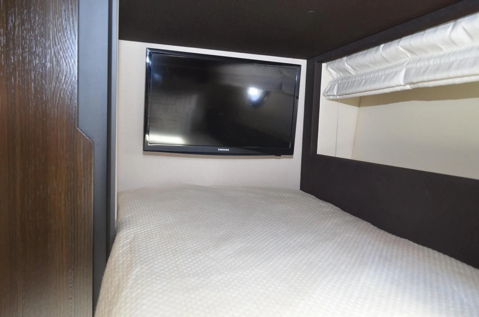 a television on a wall aboard CERULEAN Yacht for Sale