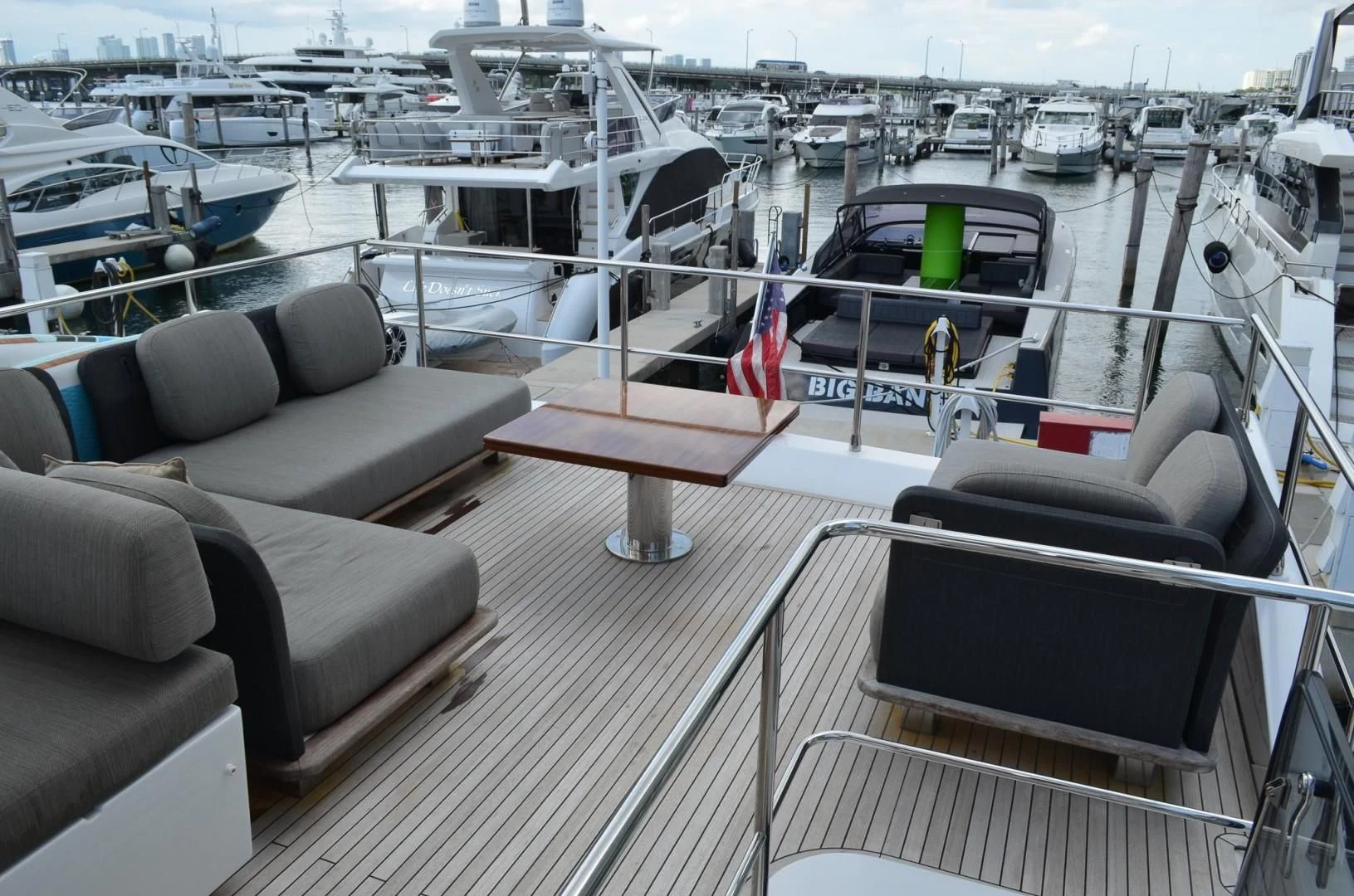 a deck with a boat and chairs aboard CERULEAN Yacht for Sale