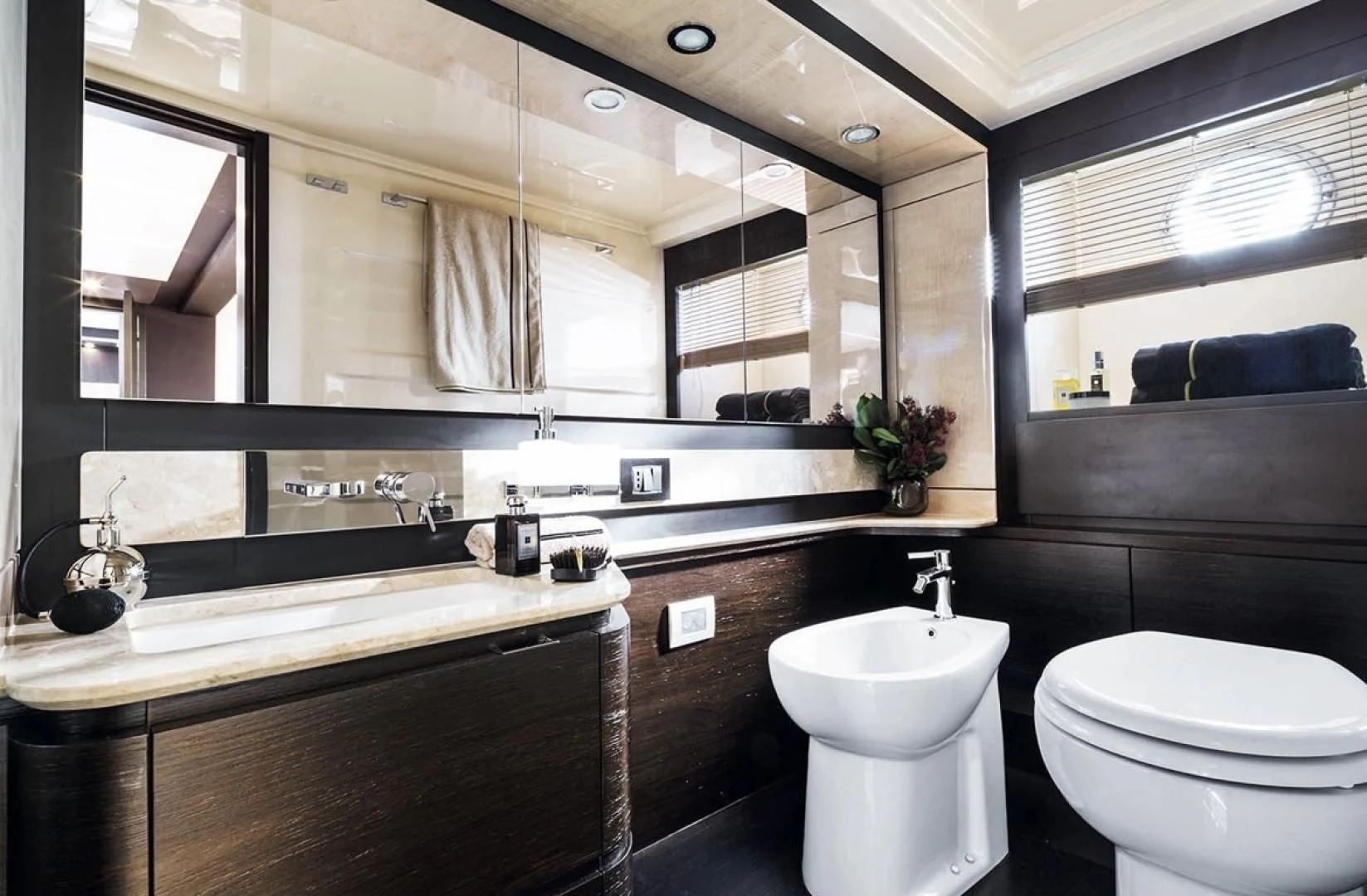 a bathroom with a large mirror aboard CERULEAN Yacht for Sale