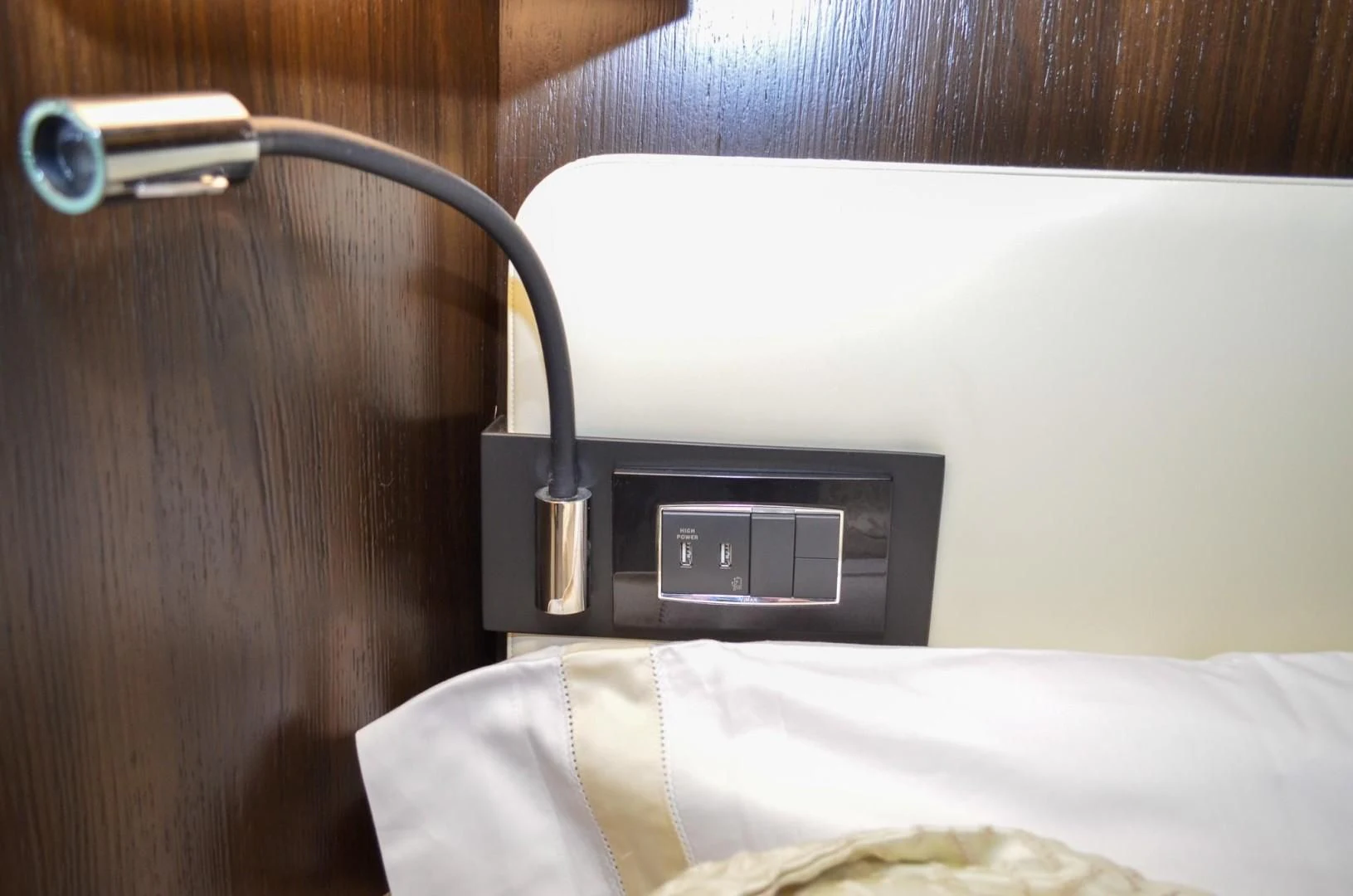 a black radio on a bed aboard CERULEAN Yacht for Sale