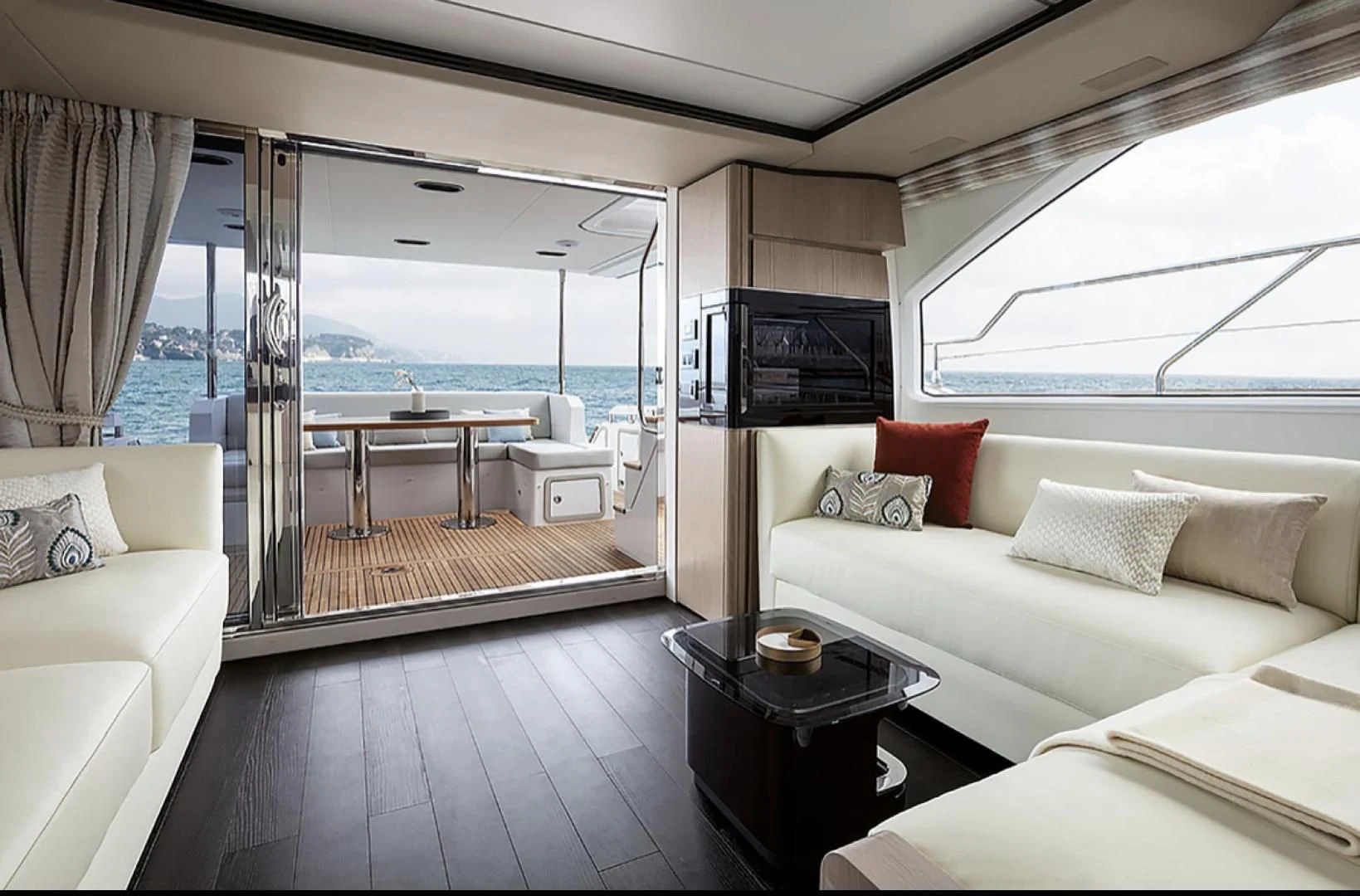 a living room with a large window aboard CERULEAN Yacht for Sale